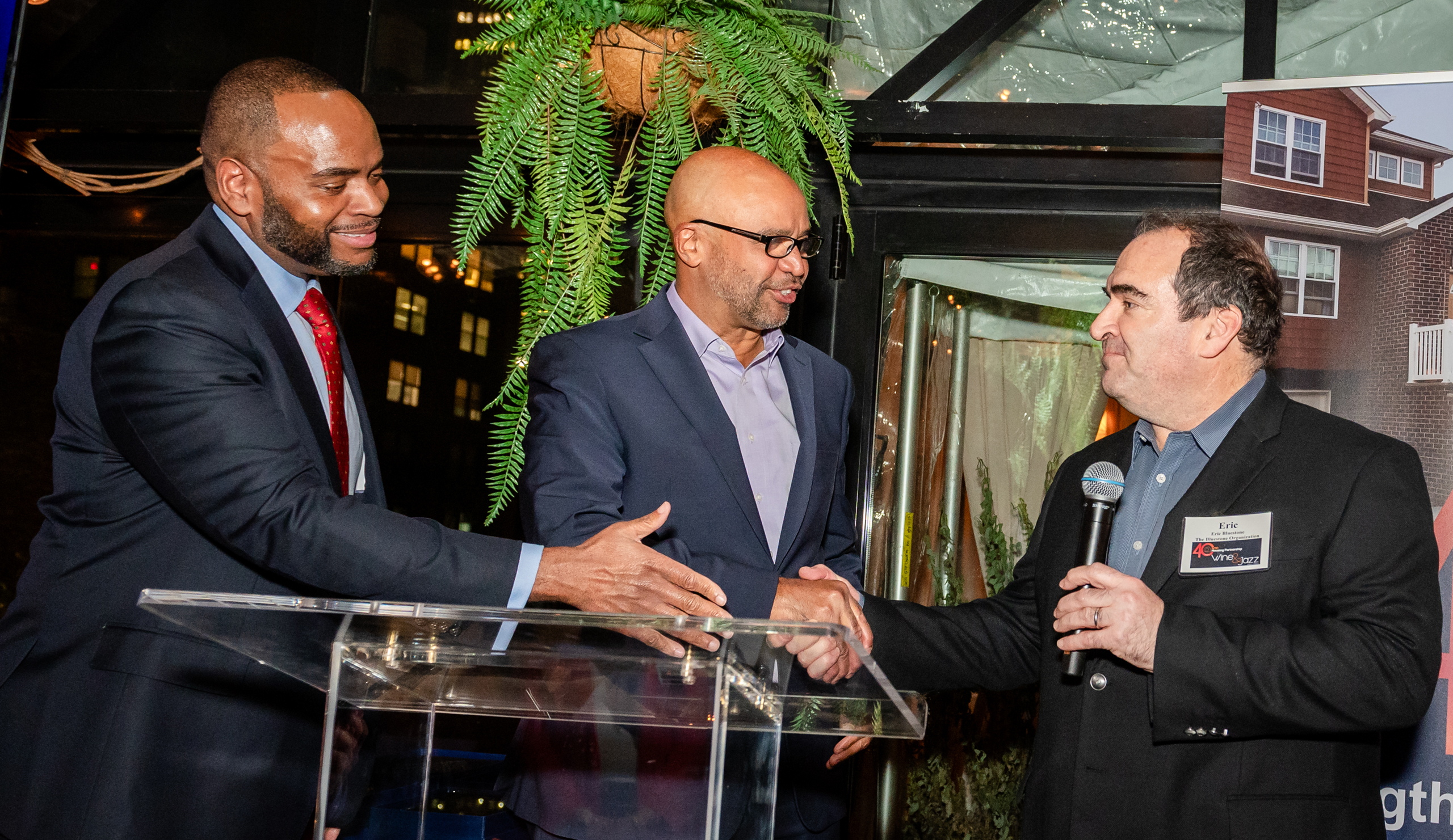 HP President & CEO Jamie Smarr (left), with NYC HPD Commissioner Adolfo Carrión, Jr. presents Eric Bluestone (right) of the Bluestone Organization with a Founding Partners award.