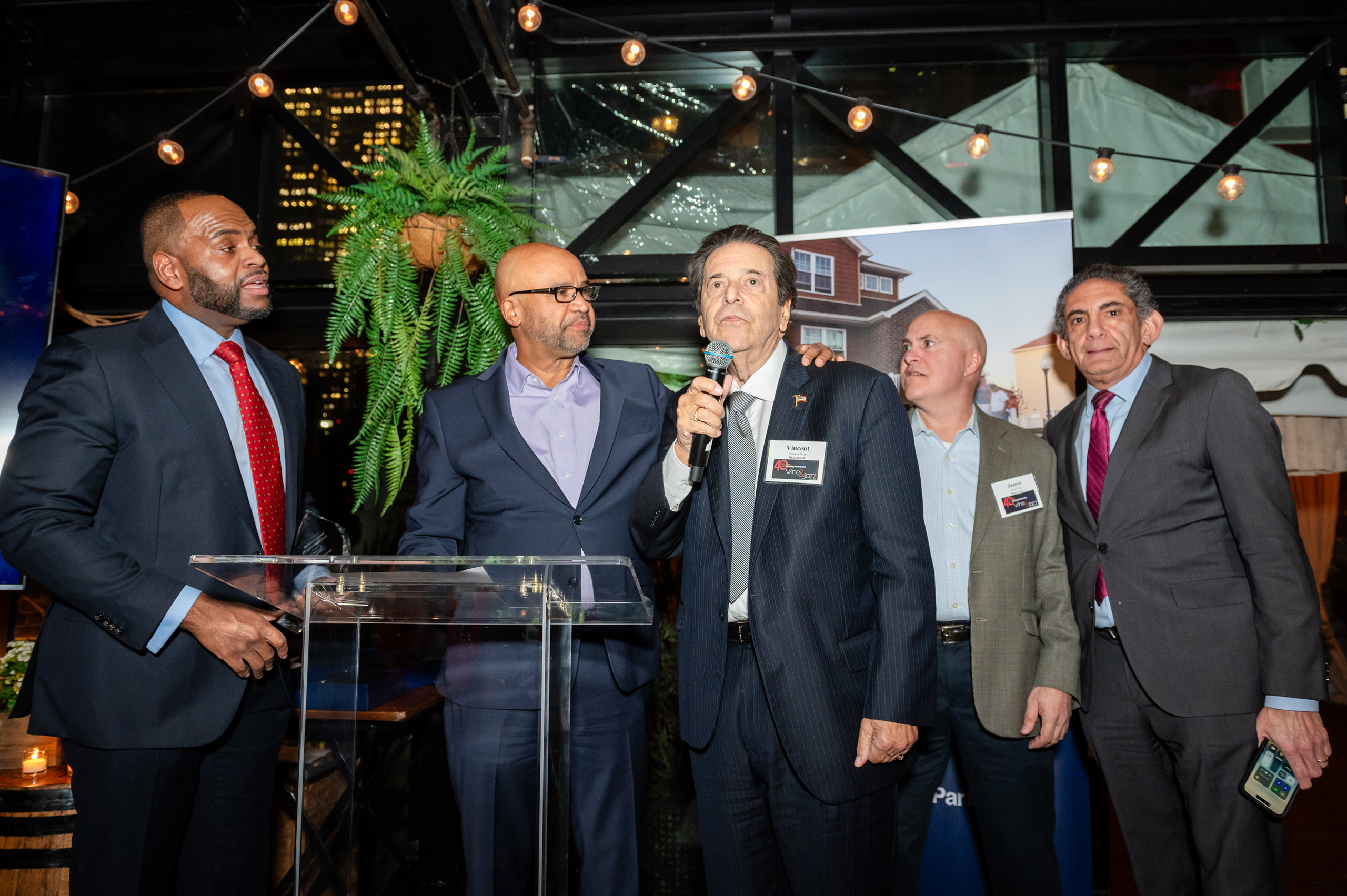HP President & CEO Jamie Smarr (left), with NYC HPD Commissioner Adolfo Carrión, Jr. as Vincent Riso and other members of the Briarwood Organization accept award.
